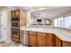 The kitchen area offers stainless steel appliances, dual ovens, and an eat-in breakfast bar at 5521 W Northwood Dr, Glendale, AZ 85310
