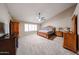 Comfortable main bedroom with a large window, ceiling fan, and carpet at 5521 W Northwood Dr, Glendale, AZ 85310