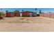 The backyard features a large patio area and a spacious yard, perfect for outdoor activities and entertaining at 7326 E Juanita Ave, Mesa, AZ 85209
