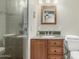 Bathroom features granite counters, wood cabinet, shower, and toilet at 7326 E Juanita Ave, Mesa, AZ 85209