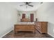 Bedroom with wood floors, ceiling fan, and two wood dressers at 7326 E Juanita Ave, Mesa, AZ 85209