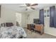Bedroom with carpet, ceiling fan, and a desk at 7326 E Juanita Ave, Mesa, AZ 85209