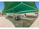 View of covered outdoor eating area, tables, chairs and community recreation area at 7326 E Juanita Ave, Mesa, AZ 85209