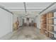 Spacious garage with built-in shelving, workbench, and lots of storage space at 7326 E Juanita Ave, Mesa, AZ 85209