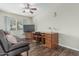 Living room with wood floors, a ceiling fan, and a desk at 7326 E Juanita Ave, Mesa, AZ 85209