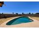Backyard view of the refreshing in-ground swimming pool and desert landscaping at 7525 W Turney Ave, Phoenix, AZ 85033