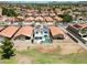 Bright home with a refreshing pool and solar panels in a neighborhood with red tile roofs near mountains at 7535 W Kimberly Way, Glendale, AZ 85308