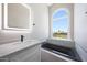 Luxurious bathroom featuring soaking tub, custom vanity, and updated lighting at 7535 W Kimberly Way, Glendale, AZ 85308