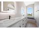 Modern bathroom featuring dual vanity, soaking tub, and updated finishes at 7535 W Kimberly Way, Glendale, AZ 85308