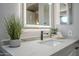 Modern bathroom with updated faucet, stylish countertop, and lighted mirror at 7535 W Kimberly Way, Glendale, AZ 85308