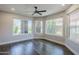 Bright bonus room boasting hardwood flooring and multiple windows offering generous natural light at 7535 W Kimberly Way, Glendale, AZ 85308
