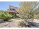Charming two-story home with a unique stone column and a meticulously landscaped front yard at 7535 W Kimberly Way, Glendale, AZ 85308