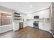 A kitchen with white cabinets, stainless steel appliances, and a view to the outside at 7535 W Kimberly Way, Glendale, AZ 85308