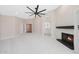 Spacious living room with fireplace, and doorway views to bathroom at 7535 W Kimberly Way, Glendale, AZ 85308