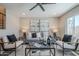 Bright living room featuring neutral tones, recessed lighting, stylish furniture and contemporary decor at 7535 W Kimberly Way, Glendale, AZ 85308