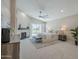 Spacious main bedroom with fireplace, vaulted ceiling, ceiling fan, and access to outdoor views at 7535 W Kimberly Way, Glendale, AZ 85308