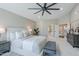 Spacious main bedroom featuring ensuite bathroom, ceiling fan, and a view of a walk-in closet at 7535 W Kimberly Way, Glendale, AZ 85308