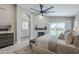 Bright main bedroom features vaulted ceiling, ceiling fan, fireplace, and backyard view at 7535 W Kimberly Way, Glendale, AZ 85308