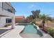 Inviting pool area with decorative rock features, palm trees, and spacious patio, perfect for outdoor relaxation at 7535 W Kimberly Way, Glendale, AZ 85308