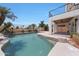 Beautiful pool area with lush landscaping, patio, and covered outdoor seating at 7535 W Kimberly Way, Glendale, AZ 85308