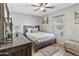 Inviting bedroom with warm wood furniture and decorative accent wall at 7575 W Darrel Rd, Laveen, AZ 85339