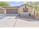 Charming single-story home with a two-car garage and low-maintenance desert landscaping at 7575 W Darrel Rd, Laveen, AZ 85339