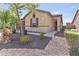 Charming single-story home with a two-car garage, desert landscaping and covered entry at 7575 W Darrel Rd, Laveen, AZ 85339
