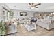 Spacious living room featuring hardwood floors, comfortable seating, and an inviting atmosphere at 7575 W Darrel Rd, Laveen, AZ 85339