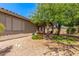 Landscaped backyard featuring desert landscaping and covered patio for comfortable outdoor living at 7617 E Desert Honeysuckle Dr, Gold Canyon, AZ 85118