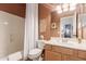 Cozy bathroom featuring a shower-tub combination and oak vanity at 7617 E Desert Honeysuckle Dr, Gold Canyon, AZ 85118