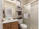Neutral-toned bathroom with shower, wood vanity, and soft towels at 7617 E Desert Honeysuckle Dr, Gold Canyon, AZ 85118