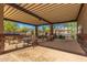 Community area with shaded seating and mountain views, perfect for socializing and relaxation at 7617 E Desert Honeysuckle Dr, Gold Canyon, AZ 85118