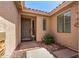 Close-up view of a charming front porch with stylish accents and a welcoming entrance at 7617 E Desert Honeysuckle Dr, Gold Canyon, AZ 85118