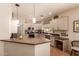 A well-designed kitchen features ample countertop space, stainless steel appliances, and neutral-toned cabinets at 7617 E Desert Honeysuckle Dr, Gold Canyon, AZ 85118