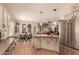 An open-concept kitchen seamlessly connects to the dining and living areas, perfect for modern living at 7617 E Desert Honeysuckle Dr, Gold Canyon, AZ 85118