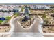 Aerial view of Monteluna community entrance with well-maintained landscaping and surrounding desert homes at 8055 E Jaeger St, Mesa, AZ 85207