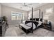 Bedroom featuring 4-post bed, neutral walls, ceiling fan, and bench with bench at 8055 E Jaeger St, Mesa, AZ 85207