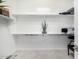 Bright, organized walk-in closet with ample shelving and neutral décor at 8055 E Jaeger St, Mesa, AZ 85207