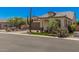 Inviting beige home with manicured landscaping, a desert-themed front yard, and a brick-paved driveway at 8055 E Jaeger St, Mesa, AZ 85207