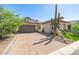 Charming single-Gathering home featuring desert landscaping, brick driveway, and a two-car garage at 8055 E Jaeger St, Mesa, AZ 85207