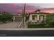 Beautiful single-Gathering home with desert landscaping, green grass, and a two-car garage at 8055 E Jaeger St, Mesa, AZ 85207