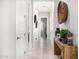 Bright hallway featuring rustic wood console table and decorative accents at 8055 E Jaeger St, Mesa, AZ 85207