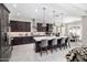 Modern kitchen with stainless steel appliances, and a large kitchen island with seating at 8055 E Jaeger St, Mesa, AZ 85207
