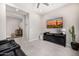 Modern living room with a large TV, stylish furniture, and neutral tones at 8055 E Jaeger St, Mesa, AZ 85207