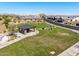 Overhead view of a Monteluna park featuring a picnic pavilion, barbecue area, and sprawling green space at 8055 E Jaeger St, Mesa, AZ 85207