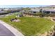 Expansive green park area in Monteluna featuring a covered picnic structure, BBQ, and manicured lawns at 8055 E Jaeger St, Mesa, AZ 85207