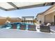 Poolside bar with views of the swimming pool, spa, and outdoor kitchen for a luxurious outdoor experience at 8055 E Jaeger St, Mesa, AZ 85207