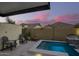Backyard retreat featuring a tranquil spa with ambient lighting and comfortable seating at 8055 E Jaeger St, Mesa, AZ 85207