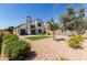 A spacious backyard with a patio, grass lawn, desert landscaping, and privacy fencing at 830 E Gila Ln, Chandler, AZ 85225