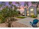 Expansive backyard featuring two patios, a lawn, desert landscaping, and a view of the home at 830 E Gila Ln, Chandler, AZ 85225